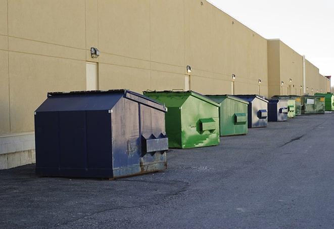 a yellow construction dumpster filled with waste materials in Burbank, CA